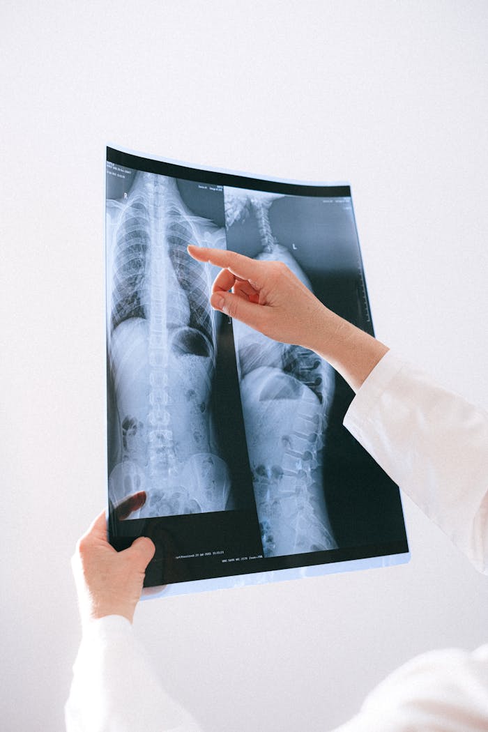why-choose-us A medical professional examines a chest x-ray to diagnose health issues.